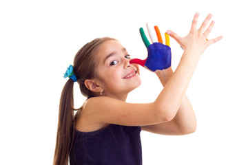 Little girl with colored hands