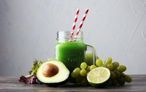 Healthy green smoothie and ingredients - detox, diet, health, vegetarian food concept