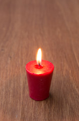 Candle on wooden table