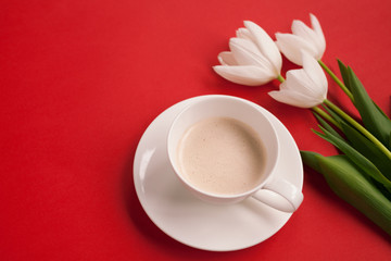Fototapeta na wymiar Coffee cup and soft white flowers