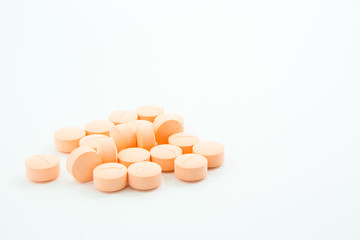 Obraz na płótnie Canvas Orange analgesics on white background.