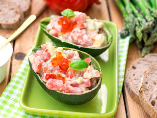 Stuffed avocado with tomato, garlic and mayonnaise
