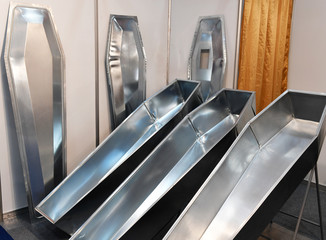 Obraz premium Luxury coffins at a funeral exhibition 