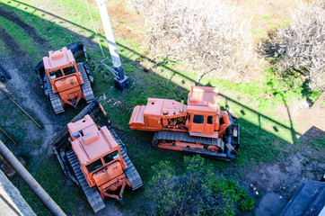 Red bulldozers at a construction site