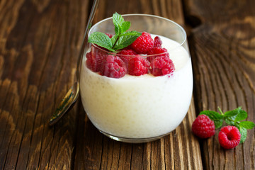 Dessert tapioca with coconut milk and raspberry