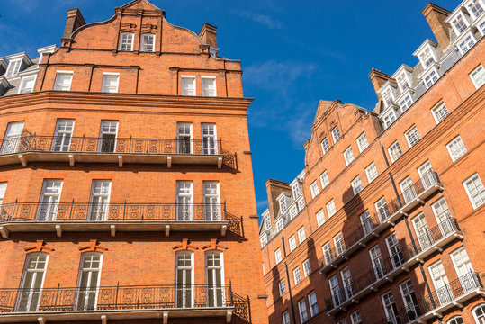 Opulent restored elegant Victorian period building in red bricks and white windows in South Kensington, London, UK