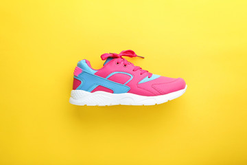 Sport shoes on yellow background
