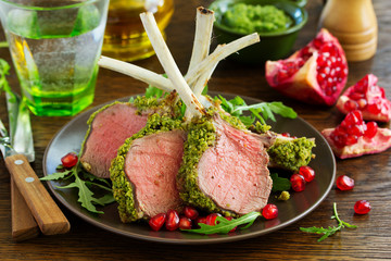 Rack of lamb in herb cheese and breadcrumbs. A festive meal. Selective focus.