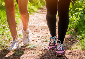 Women running in the forest