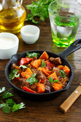Braised beef with pumpkin in red wine.