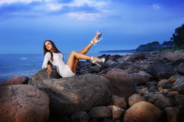 girl lying down on a rock