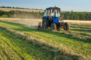 Fototapeta premium Tractor working on the farm field