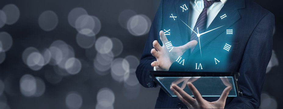Businessman hand tablet with  clock