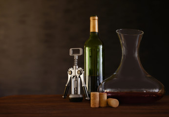 Obraz na płótnie Canvas Glass carafe of wine on wooden table