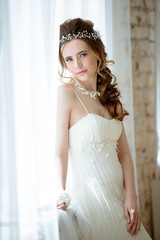 Brunette bride in fashion white wedding dress with makeup