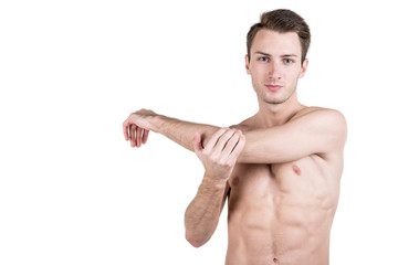 Healthy lifestyle. Portrait of a handsome guy with a sporty naked body, warming up, isolated on white background. Horizontal frame