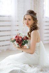 Brunette bride in fashion white wedding dress with makeup