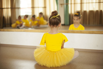 Cute little ballerina sitting in front of the mirror © vvaragic
