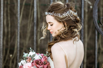 Brunette bride in fashion white wedding dress with makeup