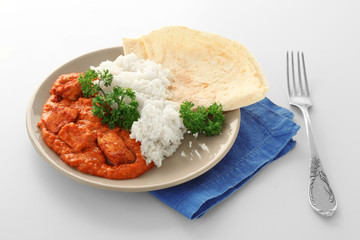 Plate with delicious Murgh Makhani on white background