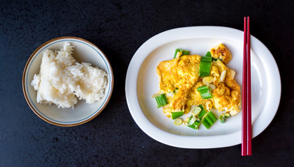 the Thai style omelet mixed with Japanese onion  bunch serve with Japanese rice