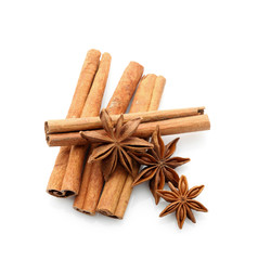 Cinnamon sticks with anise stars isolated on white, top view
