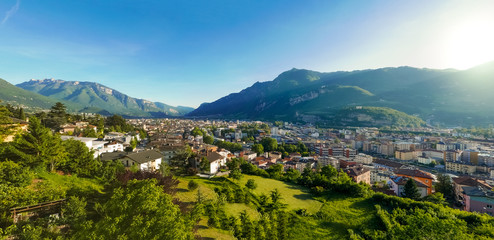 Beautiful skyline panorama of mountain town in the valley during golden hour