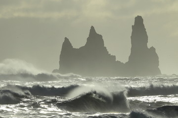 Reynisdrangar Sea Stacks, Iceland waves breaking on Renisfjara beach in front of the Reynisdrangar...