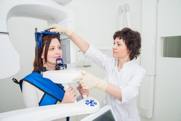 Dentist taking a panoramic digital X-ray of a patients teeth