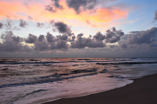 sunrise over the sea beach, cloudy