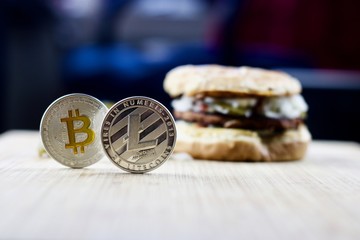Litecoin and bitcoin near burger