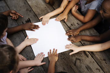Group of children hand assemble on blank banner togetherness