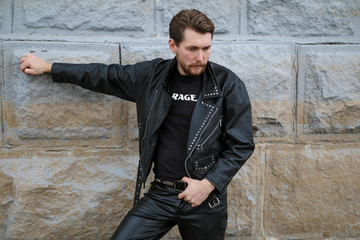 Handsome bearded man in black leather jackets