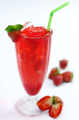 Glass of fresh strawberry tea with mint leaf on white background