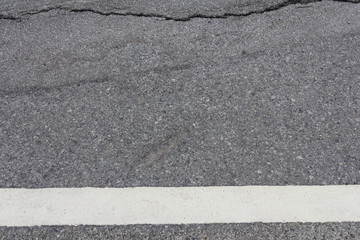 Obraz premium road surface crack is dangerous for background