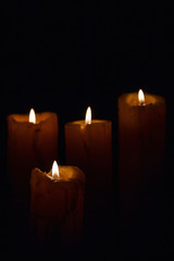 Fototapeta na wymiar Candlelight on black background