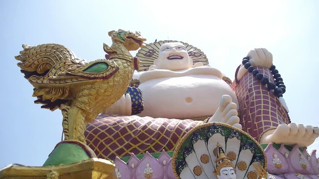 Smiling Buddha Chinese God of Happiness ,Wealth and Lucky in Public Temple. HD; 1920x1080.