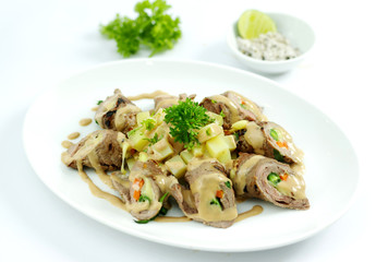 Beef rolls with cheese and lime salt on white platter