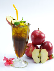 Glass of fresh apple tea with mint leaf on white background