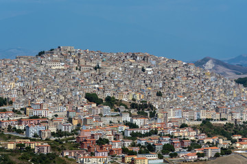 The old town of Gangi in Sicily with the silhouette of Mount Etna in the back