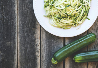 Zucchini Noodles over a wooden table