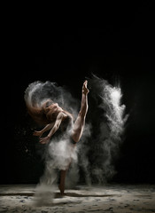 Sexy girl in a cloud of white dust studio portrait © Wisky