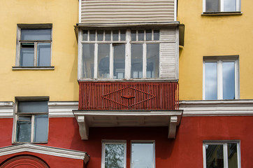  balcony on red an yellow wall with cornice
