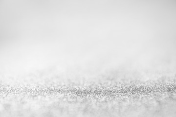 glitter gray lights abstract background, silver and white, defocused