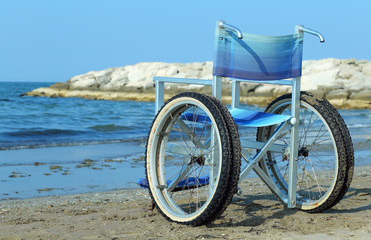 Fototapeta premium Special wheelchair with aluminum tubes to enter into the sea