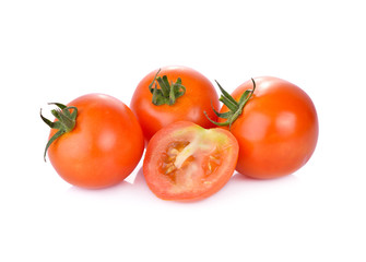 whole and half cut fresh tomato on white background