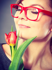 Charming woman smelling flower feel peace.