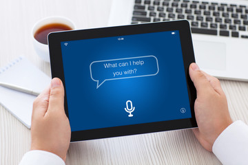 tablet with app personal assistant on screen in male hands