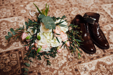 wedding bouquet with man shoes
