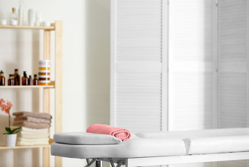 Interior of massage room in modern wellness center